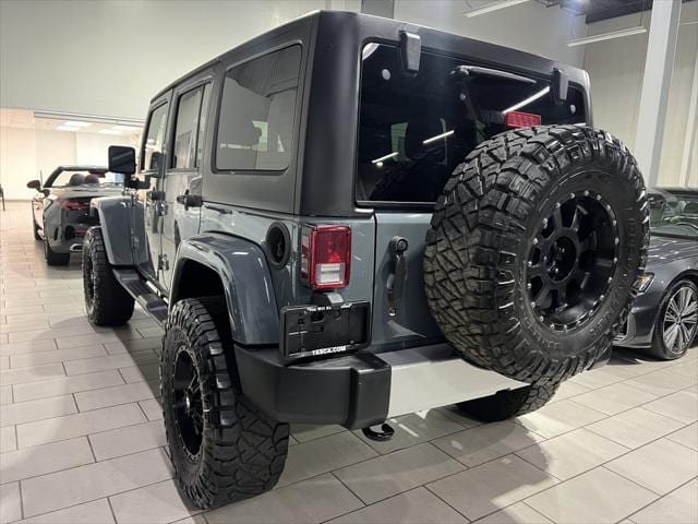 Used 2014 Jeep Wrangler Unlimited Sahara with VIN 1C4BJWEG0EL128260 for sale in Secaucus, NJ