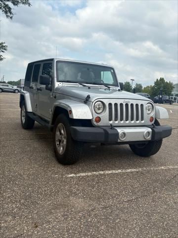 Used 2010 Jeep Wrangler Unlimited Sahara with VIN 1J4BA5H15AL117907 for sale in Maplewood, Minnesota